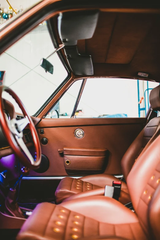 the interior of a vehicle with wooden trim