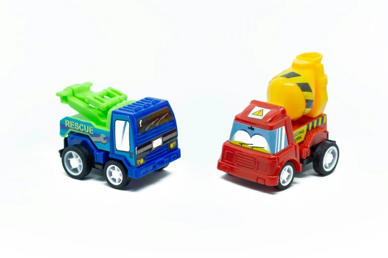 toy trucks on white background with no one around