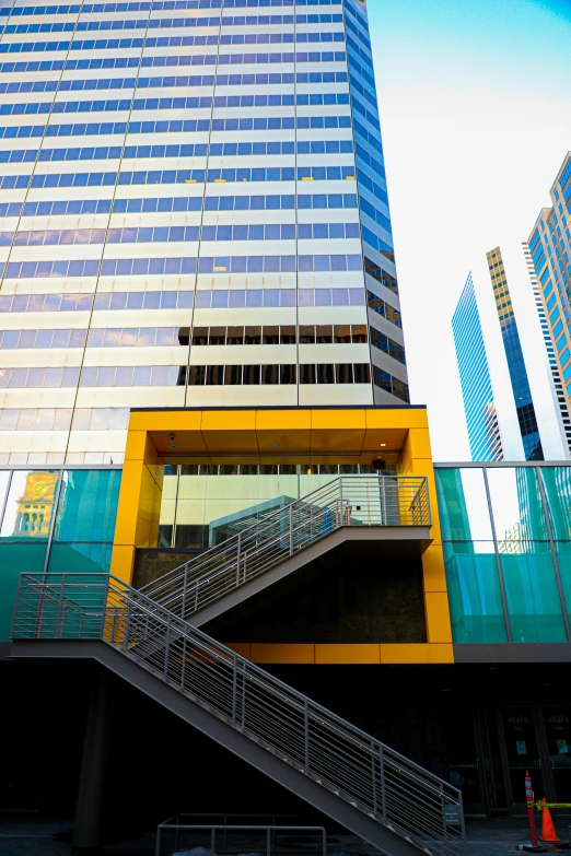 staircase going up to some modern buildings in the city