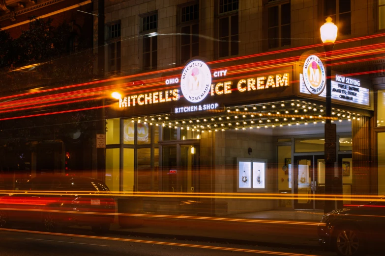 the front of an ice cream shop at night