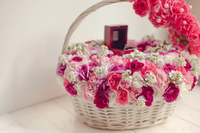 the basket has several beautiful flowers in it