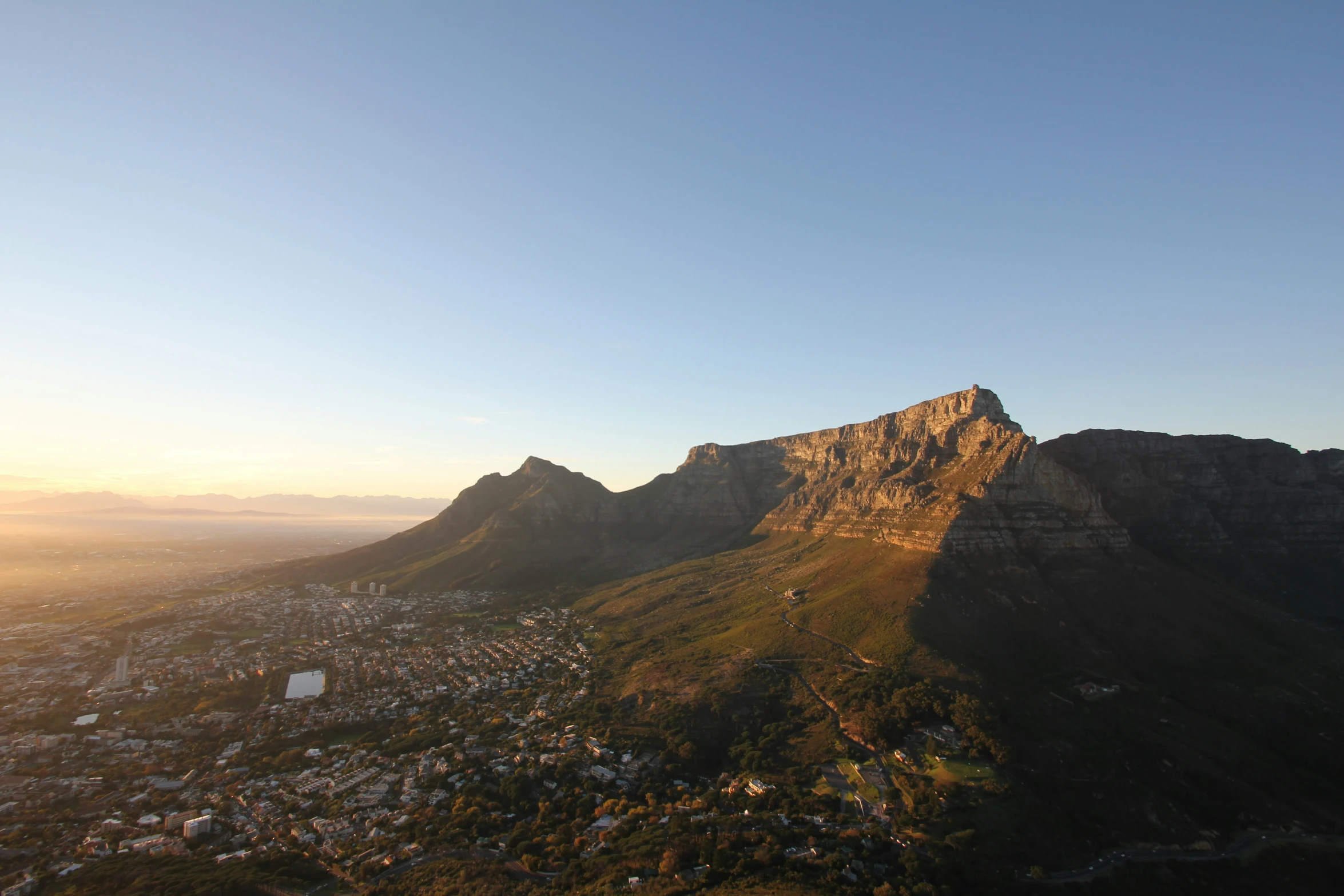 a view from the top of a hill in the day