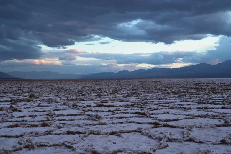 the view of a wide expanse of snow in the middle of the desert