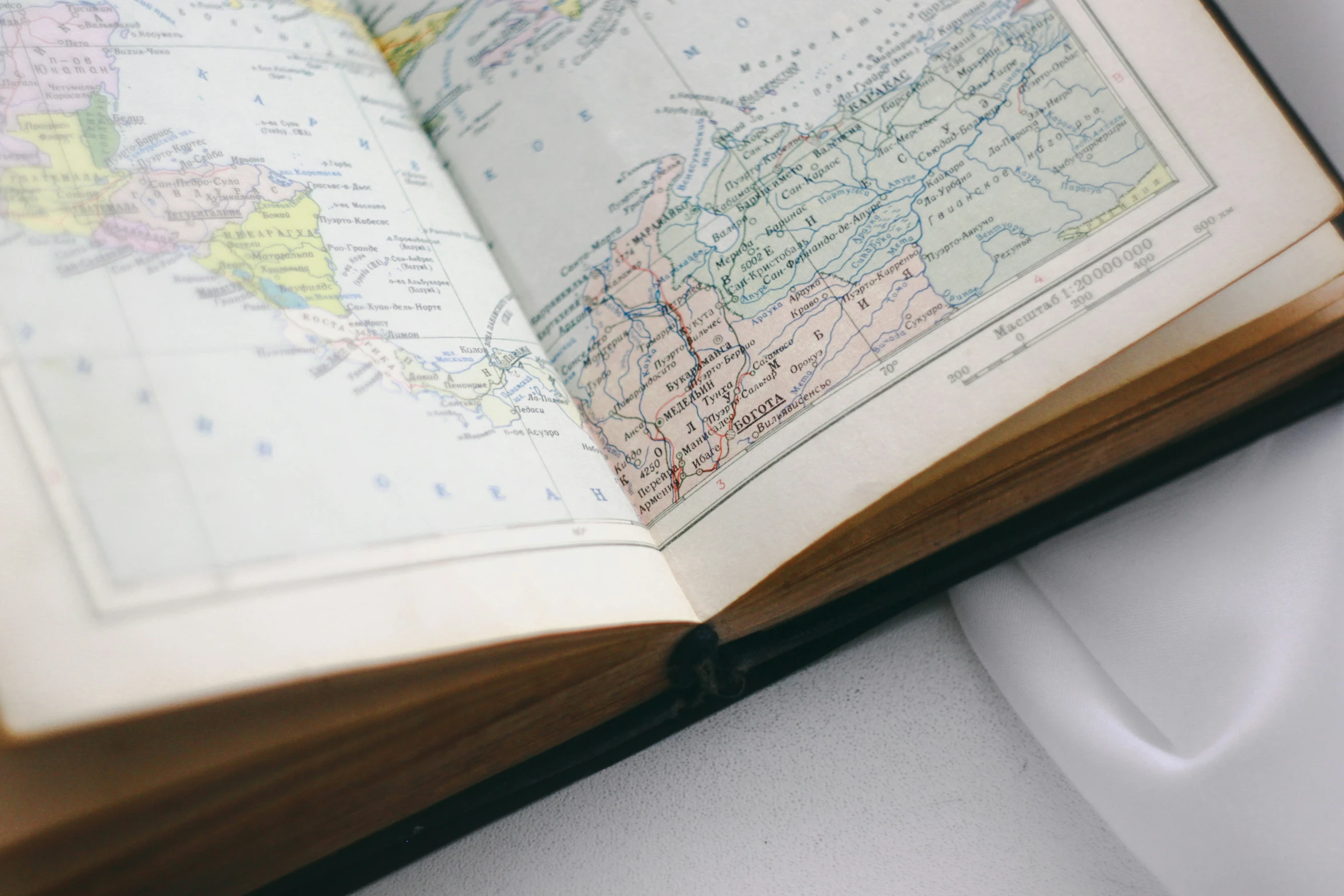 a map lies open on top of a notebook