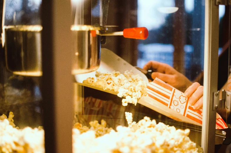 the popcorn maker is making homemade movie snacks