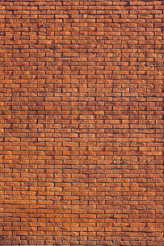 an orange wall with small s in it