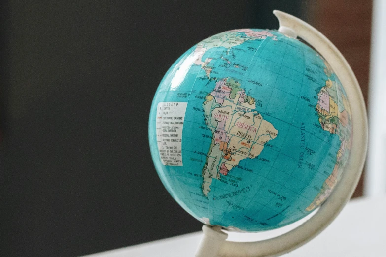 an old globe is sitting on a table