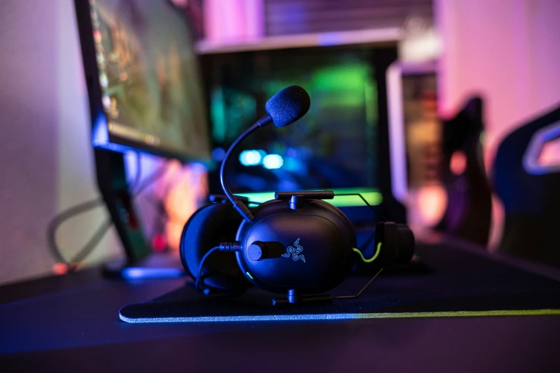 a gaming system sitting on a table with headphones