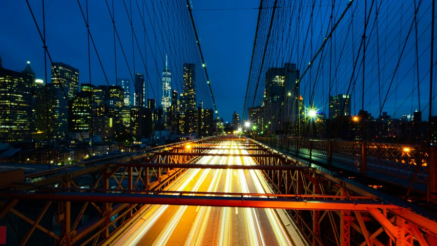 a very long exposure of some lights on a bridge