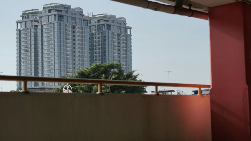 looking out over a building from an apartment balcony