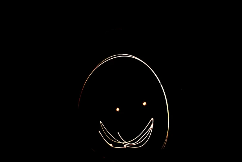 a drawing of a face in the middle of the night
