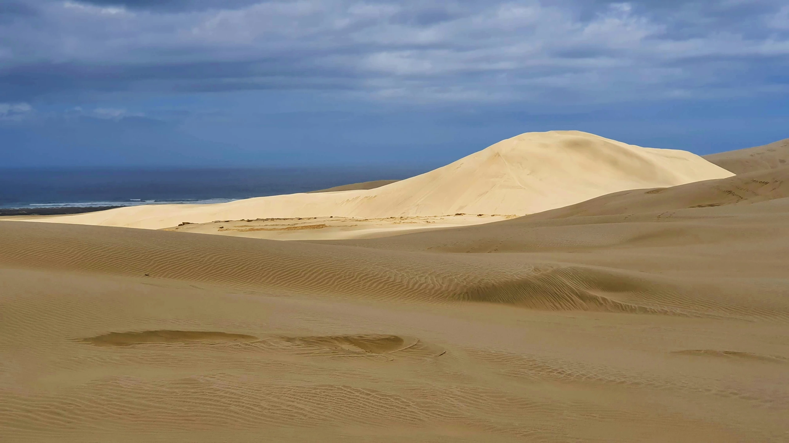 the sand dunes with a sky background