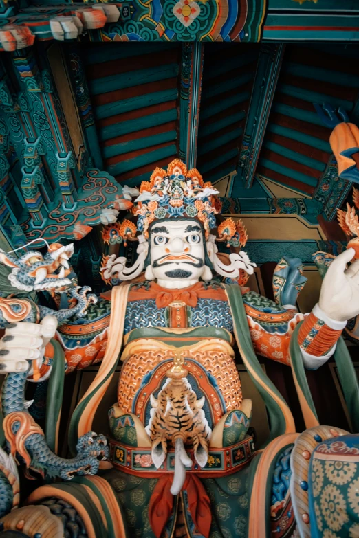 colorfully painted statues depicting buddhas and other deities