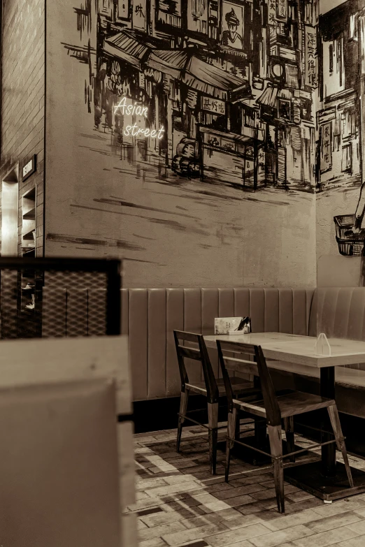 a long table in a room next to an old painting