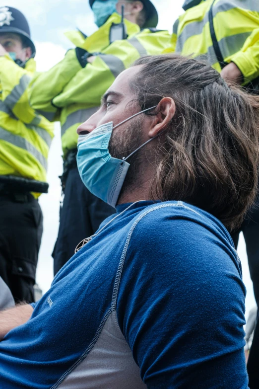 an individual wearing a face mask during a protest