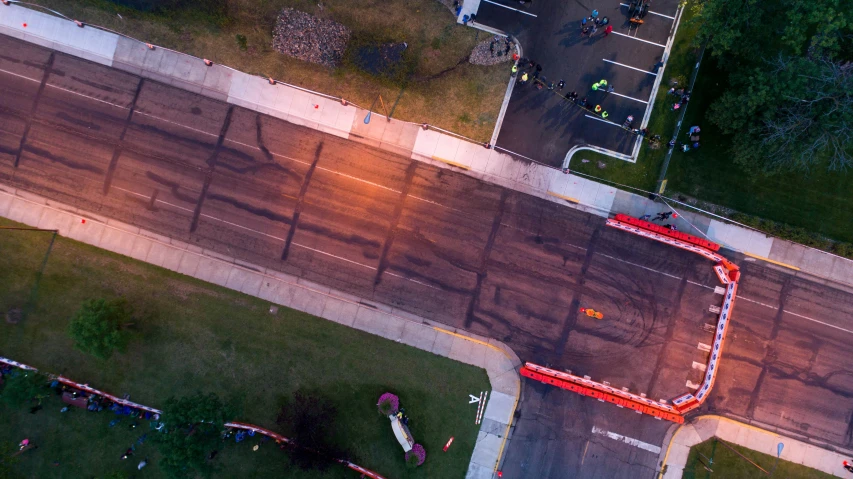 a long red ladder on top of the road