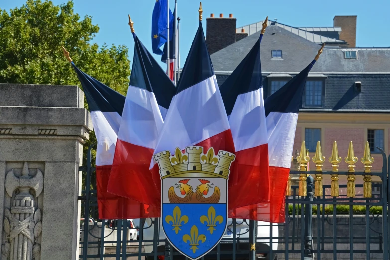 two flags are seen sticking out of the fence