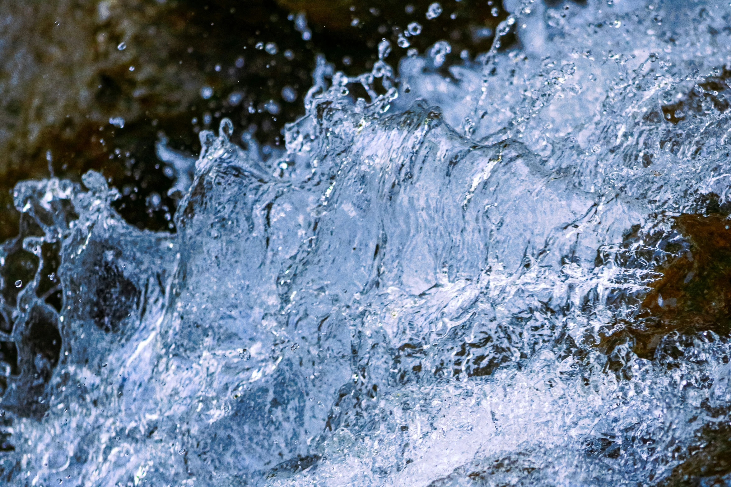 a close up view of a bunch of water shooting from the bottom