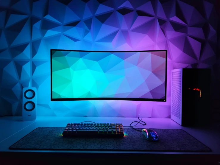 a computer monitor sitting on top of a desk next to a keyboard