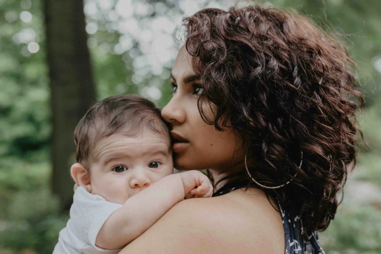 an image of a woman holding a baby