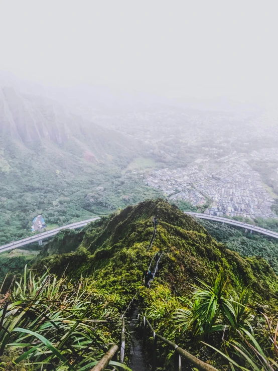 the sky is foggy as there are many mountains