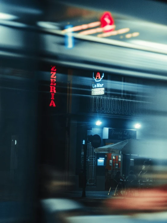 an urban train is passing by a building