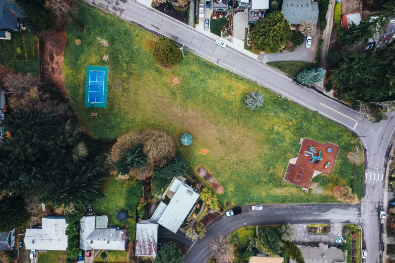 an overhead view of a small house and an overhead road