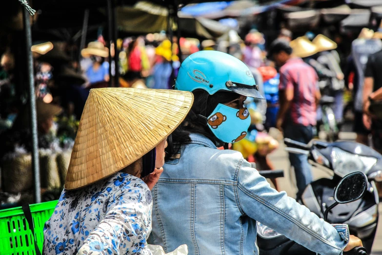 there is a person wearing a helmet and a motorcycle helmet