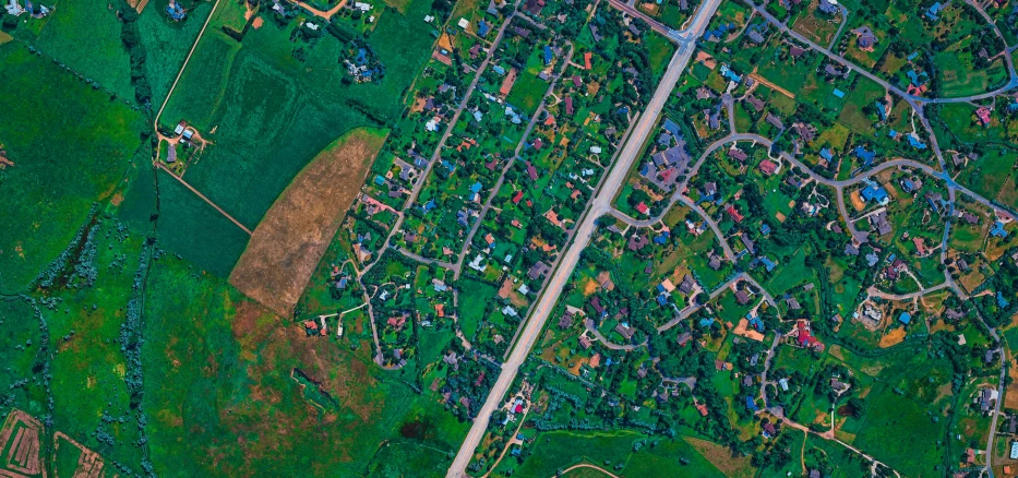 the satellite view shows the green countryside with lots of trees and dirt