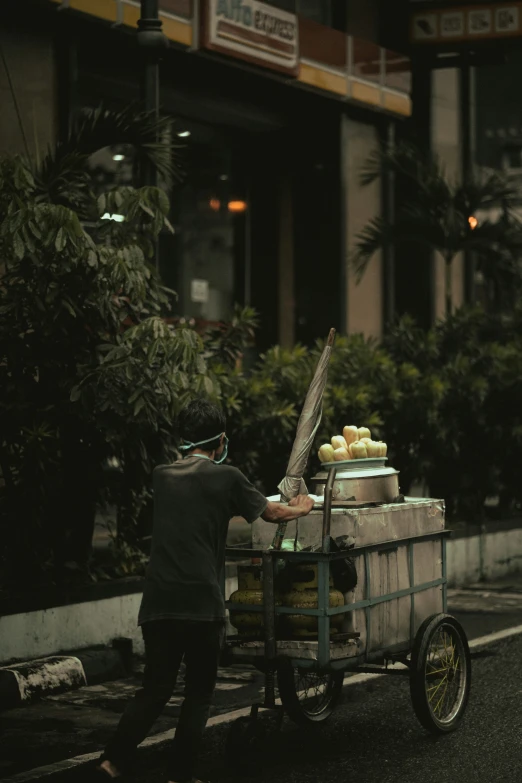 two people unloading and preparing food on the side of the road