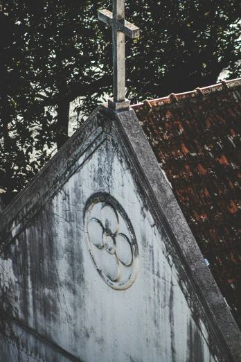 an olympic symbol is pictured on the side of a church roof