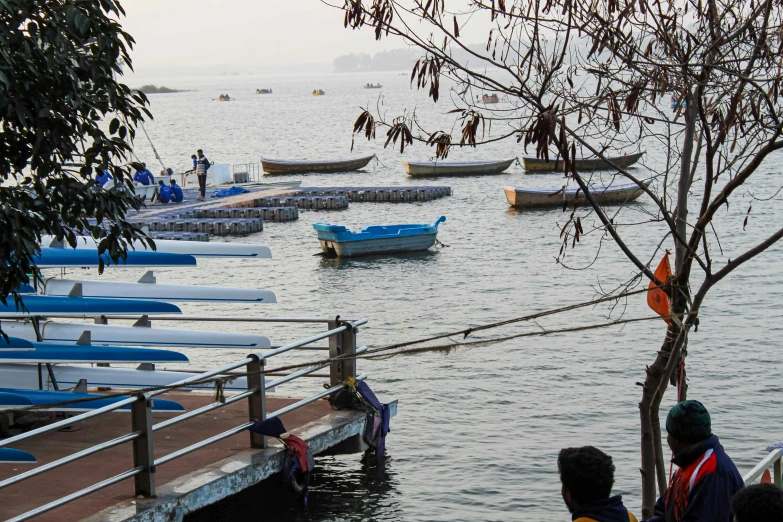 a group of people who are watching the water