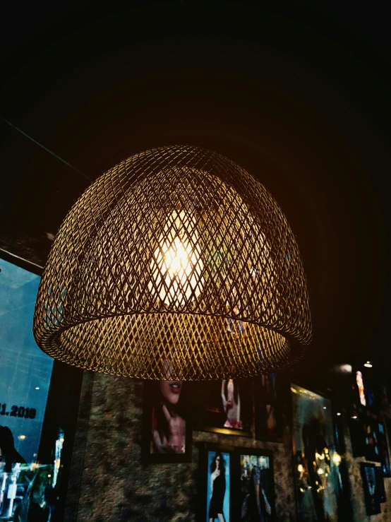 a lit lamp sitting above a table