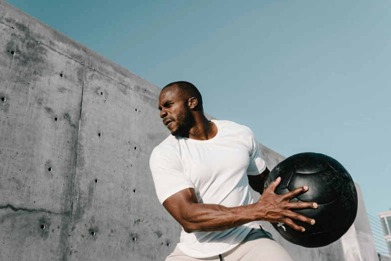 a man with his hand on a ball