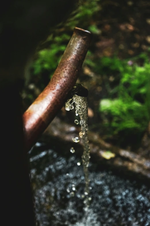 water coming out from the pipe as it spouts