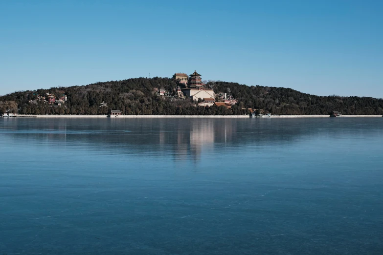 a large body of water near an island with a castle on it