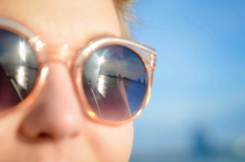 a person with some big pretty pink sunglasses