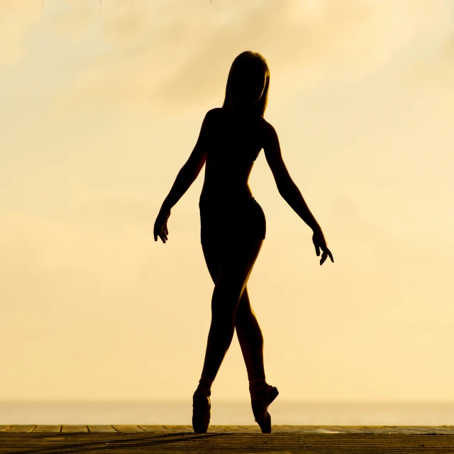 a woman is standing in the desert with an umbrella