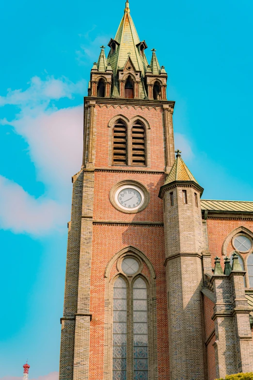 the large, bricked building has windows and a clock