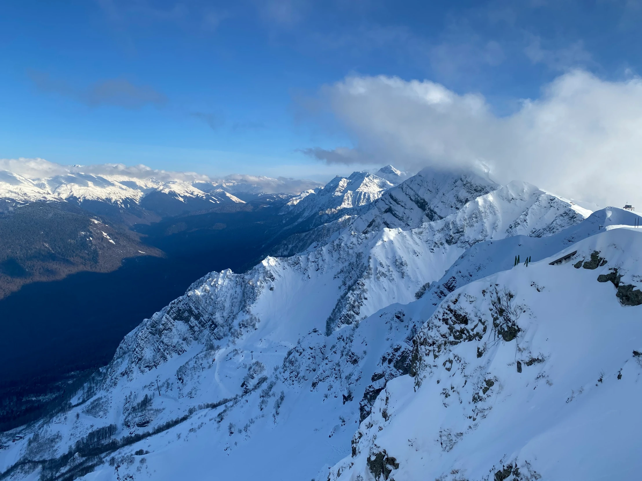 a view from the top of a snowy mountain