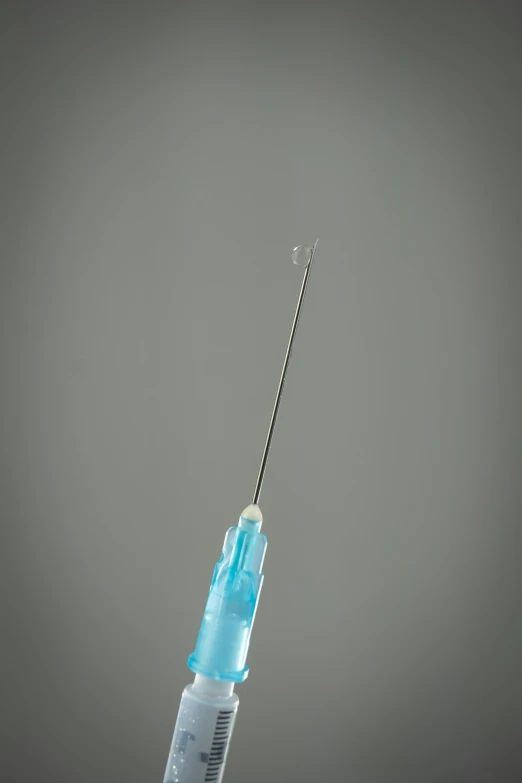 the blue medical instrument is connected to the pole