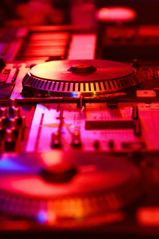an dj mixing pad and sound decks in a room