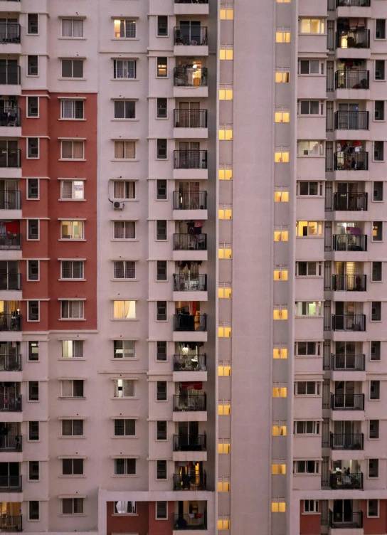 buildings all in different levels and windows lit up with light