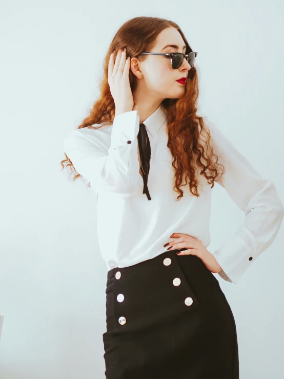 an image of a woman that is wearing a tie and sunglasses