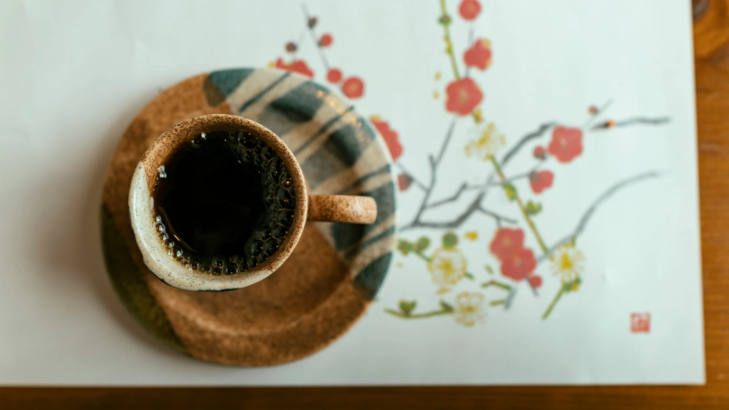 a cup of  coffee on a plate