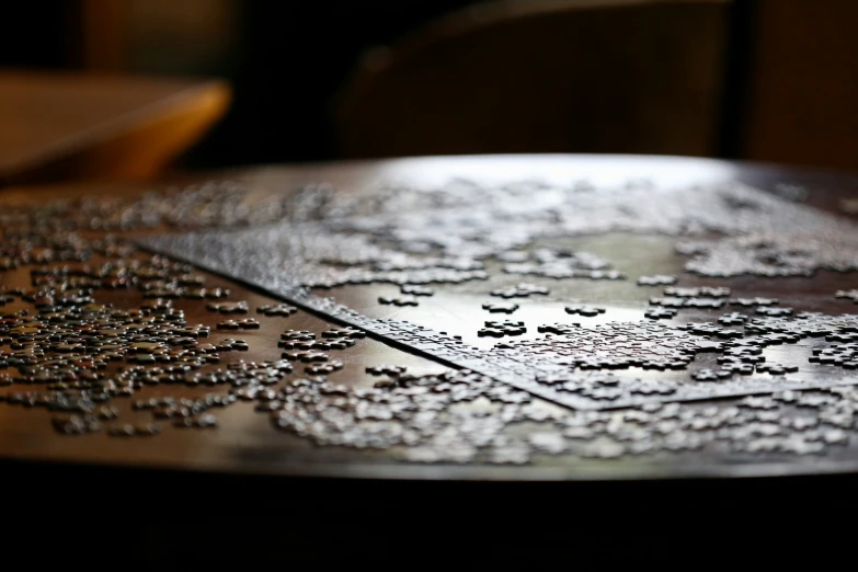 an artistic plate sitting on a table with a star pattern