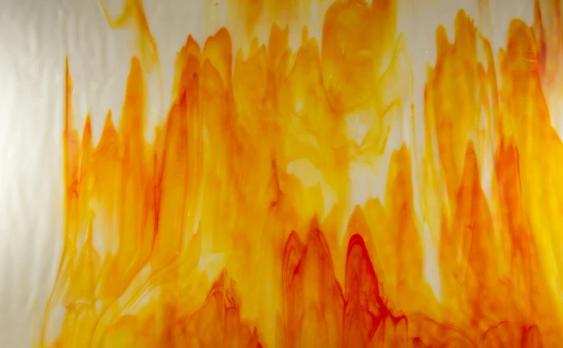 orange and yellow fluid painting with a white background