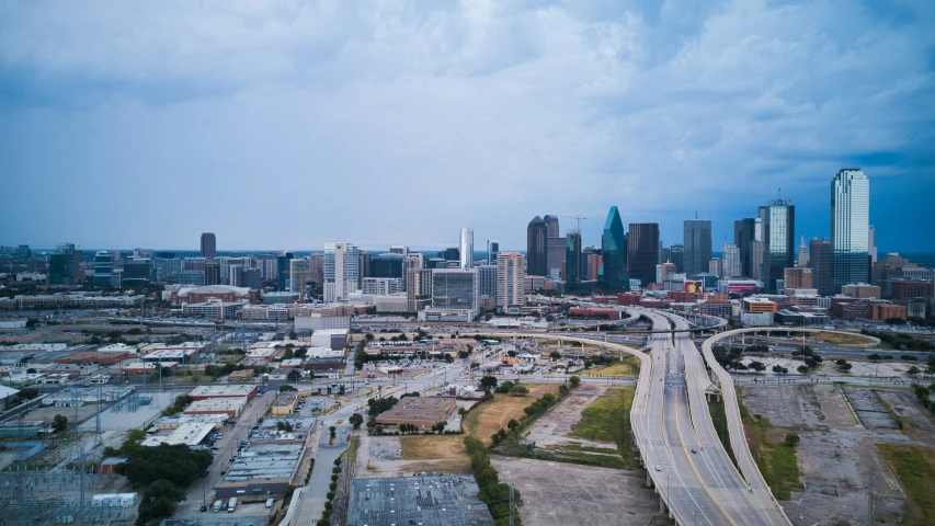 a highway runs through a large city in the day