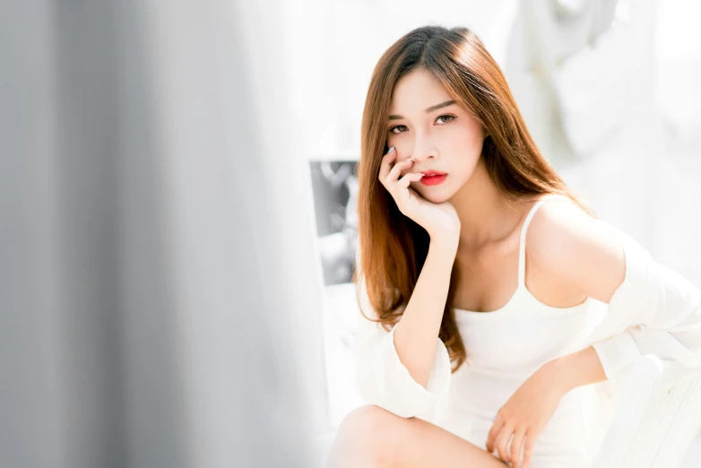 a woman poses in front of a mirror