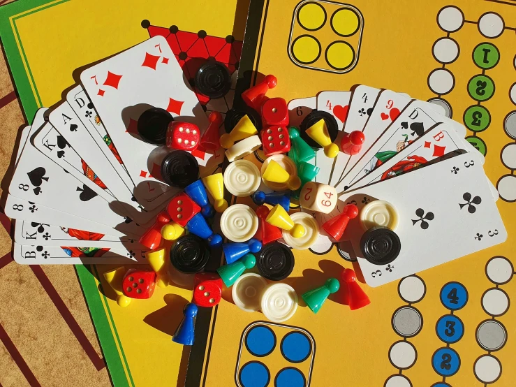 a bunch of ons and playing cards on top of a table